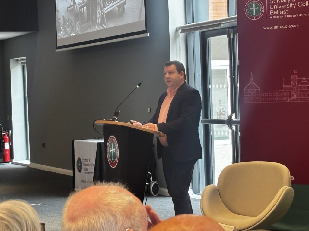 Dr Cormac Moore photographed at the podium delivering the annual Eamon Phoenix memorial lecture